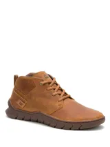 Botas tipo sneaker de cuero marrón claro Caterpillar, con cordones al tono y suela de goma texturizada.
