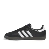 Championes Adidas Samba Og negros con las tres tiras blancas y suela marrón.