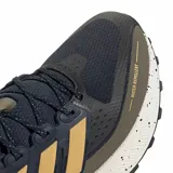 Championes de running Adidas Ultra Run 5 TR, diseñados para terrenos mixtos. Presentan un exterior de malla técnica en color azul oscuro con tratamiento repelente al agua, detalles en tono dorado y verde oliva, y una mediasuela blanca con efecto salpicado. Incluyen suela de alta tracción y tecnología de amortiguación Bounce.