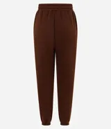 Pantalón jogger de corte holgado confeccionado en tejido fleece color beige, con cintura elástica y puños ajustados en el bajo. Cuenta con bolsillos laterales.
