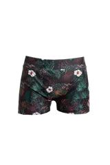 Short de tiro medio con estampado de hojas de palmera y flores de hibisco en tonos verde, marrón y blanco.