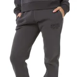 Pantalón de jogging negro, marca Rip Curl, modelo Surf Staple, con cintura elástica ajustable con cordón, bolsillos laterales y logo estampado en la pierna izquierda.