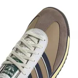 Championes urbanos Adidas modelo SL 72, con diseño retro en tonos marrón, gris y azul marino. Presenta el logo de la marca en el lateral y una suela de goma con entresuela en tono crema.
