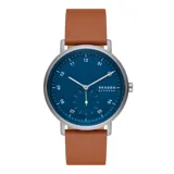 Reloj Skagen Kuppel con caja de acero inoxidable plateado de 44mm de diámetro, esfera azul, cristal mineral y correa de cuero marrón de 22mm de ancho. Cuenta con movimiento de cuarzo de dos agujas con segundero pequeño y resistencia al agua de 5 ATM.