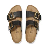 Sandalia Birkenstock modelo Sydney con dos correas ajustables de material sintético Birko-Flor en color negro, hebillas grandes doradas y plantilla anatómica de corcho con suela de goma.