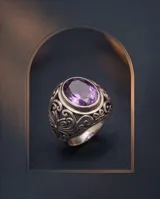 Anillo de plata 925 con diseño calado de estilo hindi y piedra facetada color amatista en formato ovalado.