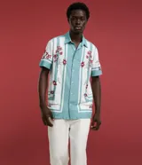 Pantalón de corte recto y estilo sastre de la marca Marfinno, color blanco, con cintura con trabillas, cierre frontal tradicional y bolsillos laterales. Confeccionado en una mezcla de liocel y algodón.