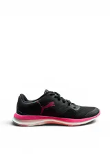 Championes deportivos Puma modelo Flex T1, color negro con detalles en fucsia y suela blanca, diseñados en material textil tipo malla para mayor transpirabilidad.