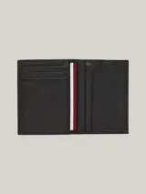Billetera plegable Tommy Hilfiger de cuero granulado color negro, con múltiples ranuras interiores para tarjetas, compartimento para billetes, cinta distintiva en el interior y logo en la parte delantera.