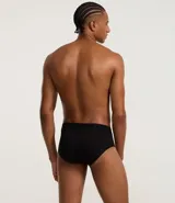 Calzoncillo slip negro de poliamida con cintura elástica y logo Mash en blanco.