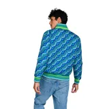 Campera reversible Umbro color turquesa con cuello, puños y dobladillo a rayas verdes, azules y blancas. Tiene cierre frontal y logo bordado en el pecho.