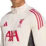 Camiseta de fútbol Adidas del Liverpool FC, modelo Tiro 25. Color crema con detalles en rojo y negro. Cuello alto con cierre de cremallera, mangas largas con puños con abertura para el pulgar, escudo del club termotransferido y tecnología Aeroready.