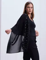Pashmina negra de gasa con apliques de brillos geométricos.