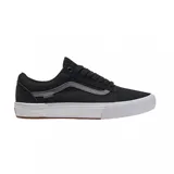 Championes Vans modelo BMX Old Skool, color negro con la icónica banda lateral en gris oscuro. Presentan una construcción resistente con suela blanca vulcanizada y base de goma color marrón.