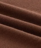 Blusa tipo muscle tee de Ashua, confeccionada en tejido ribana con textura acanalada, cuello redondo y diseño sin mangas.