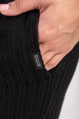 Pantalón palazzo acampanado color beige, de tejido acanalado.