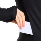 Campera deportiva New Balance color gris jaspeado, con cierre frontal completo, cuello alto y logo estampado en el pecho.