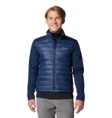Chaqueta híbrida Columbia de color azul marino, con diseño acolchado en el panel frontal y mangas lisas de tejido técnico elástico. Cuenta con cuello alto, cierre frontal completo y bolsillos laterales con cierre.