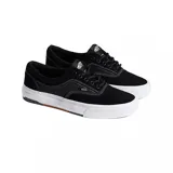 Championes Vans modelo Skate Era Wafflecup, color negro con suela blanca de plataforma y detalles en goma marrón. Presentan diseño de caña baja, cierre con cordones y costuras reforzadas.