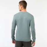 Sweater de punto con textura gofrada, cuello redondo y mangas largas con puños acanalados.