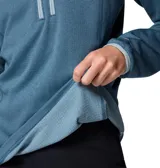 Buzo polar Columbia de cuello alto con cierre frontal parcial y bolsillo con cierre en el pecho. Presenta un diseño técnico con tecnología Omni-Wick para absorción de humedad, puños y cuello con ribetes en contraste.