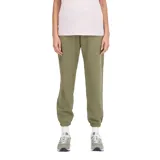 Pantalón de jogging New Balance de corte holgado, con tiro medio y puños elásticos en los tobillos. Presenta un diseño minimalista con marca discreta en la pierna.