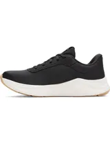 Championes de entrenamiento Under Armour modelo W Aurora 3, diseñados específicamente para el pie femenino. Presentan una parte superior de malla transpirable en color negro con detalles en gamuza, mediasuela blanca con amortiguación Charged+ y suela de goma color caramelo con patrón de tracción multidireccional.