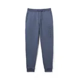 Pantalón de jogging gris con cintura elástica ajustable con cordón, bolsillos laterales y logo de Hurley estampado en la pierna izquierda.