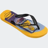 Ojotas Havaianas con diseño estampado de Los Simpson, presentando a Krusty el payaso y Bart Simpson con estilo graffiti. Poseen tiras blancas anchas con el logo de la marca en relieve y base de color turquesa.
