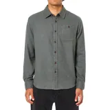 Camisa de manga larga confeccionada en franela de algodón con tejido de sarga bicolor, cuenta con cuello clásico, cierre frontal con botones y un bolsillo en el pecho.