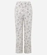 Pantalón de pijama de corte recto, color beige con estampado integral de osos. Presenta cintura elástica con lazo ajustable.