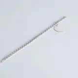 Pulsera de cadena tipo rolo en plata 925, con un dije colgante en forma de corazón liso apto para grabado.
