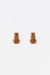 Aros tipo caravanas con diseño de conejito en color blanco con acabado flocado.