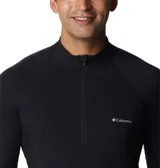 Capa base técnica Columbia de manga larga con cierre frontal parcial y cuello alto. Presenta un diseño ajustado con costuras ergonómicas, aberturas para los pulgares en los puños y logo de la marca estampado en el pecho.