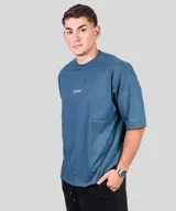 Remera negra de algodón, corte oversize, con inscripción 'GAINS.' en el frente.