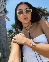 Brazalete abierto de bronce con forma de rama.