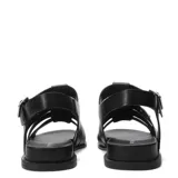 Sandalias tipo gladiadora marca Bottero, confeccionadas en cuero gamuzado color marrón. Presentan tiras anchas entrelazadas, suela plana de color negro y cierre lateral con hebilla metálica ajustable.