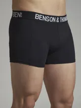 Pack de dos boxers negros de corte trunk con cintura elástica con la marca Benson & Thomas en blanco.