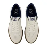 Championes New Balance Numeric 272, modelo de skate en color beige con detalles en azul marino y suela de goma marrón.