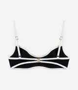 Top de bikini con aros color negro y detalles de bies en tono crudo, confeccionado en microfibra texturizada. Presenta tirantes finos ajustables y copas estructuradas que brindan soporte.