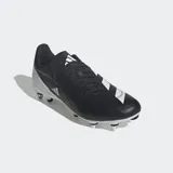 Championes de rugby Adidas modelo RS15 para terreno blando, con diseño en color negro y blanco. Presentan un exterior sintético suave, sistema de cordones asimétrico para mayor precisión al patear, cuello y talón acolchados para mayor confort, y suela con tapones metálicos diseñada para terrenos blandos.