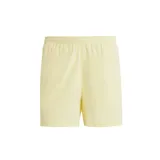 Shorts deportivos Adidas Own The Run color amarillo pálido, con cintura elástica, tecnología Aeroready y detalles reflectantes.