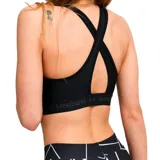 Top deportivo Under Armour de soporte medio, color negro, con diseño de espalda cruzada y banda elástica inferior con el logo de la marca estampado.