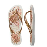 Sandalias tipo ojotas Havaianas modelo Slim Organic, con base blanca estampada con flores en tonos marrones y rosados, y tiras finas en color dorado.