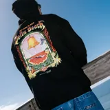 Canguro negro con capucha y cordones ajustables, bolsillo frontal tipo canguro y estampado gráfico pequeño en el pecho con la inscripción Rip Curl Pro Bells Beach Australia.