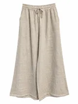 Pantalón ancho color beige de lino, con cintura elástica fruncida y cordón ajustable delantero.