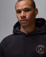 Canguro negro con capucha, de la colaboración entre PSG y Jordan. Presenta el logo del Paris Saint-Germain en el pecho y un bolsillo tipo canguro.