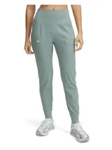 Pantalón tipo jogger de entrenamiento Under Armour, color verde menta, con cintura alta y ancha, bolsillos laterales abiertos y puños elásticos en los tobillos.