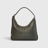 Cartera Bubba modelo Dakota de estilo hobo, color verde oscuro, con cierre superior y asa ajustable.