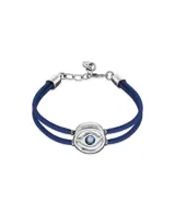 Pulsera de cuero azul con doble tira, dije central plateado con forma de ojo y cristal celeste.